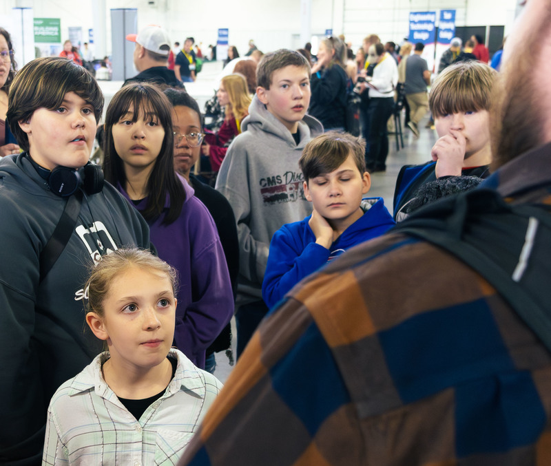 A group of CMS students listen to SkillsUSA coach Ben Loefellholz discuss the culinary competition at the Nebraska SkillsUSA competition.