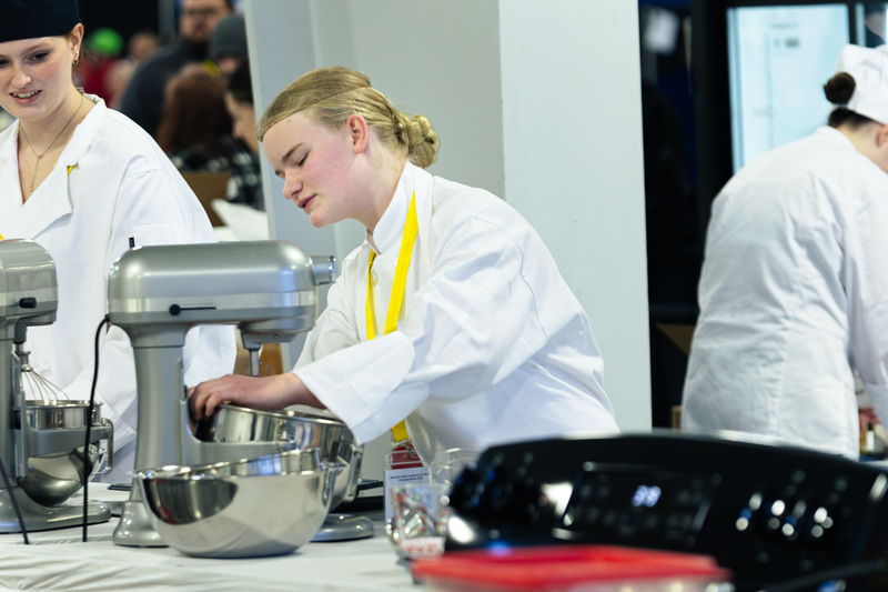 A CHS student prepares for the baking competition during the Nebraska SkillsUSA event.