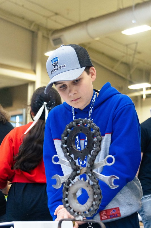 A CMS student looks at a metal sculpture on display the Nebraska SkillsUSA competition.