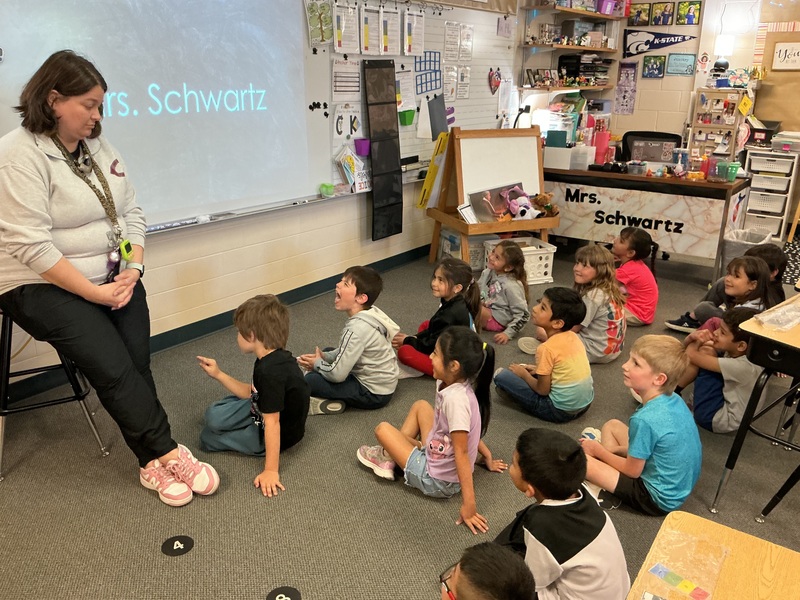 Children listening to teacher