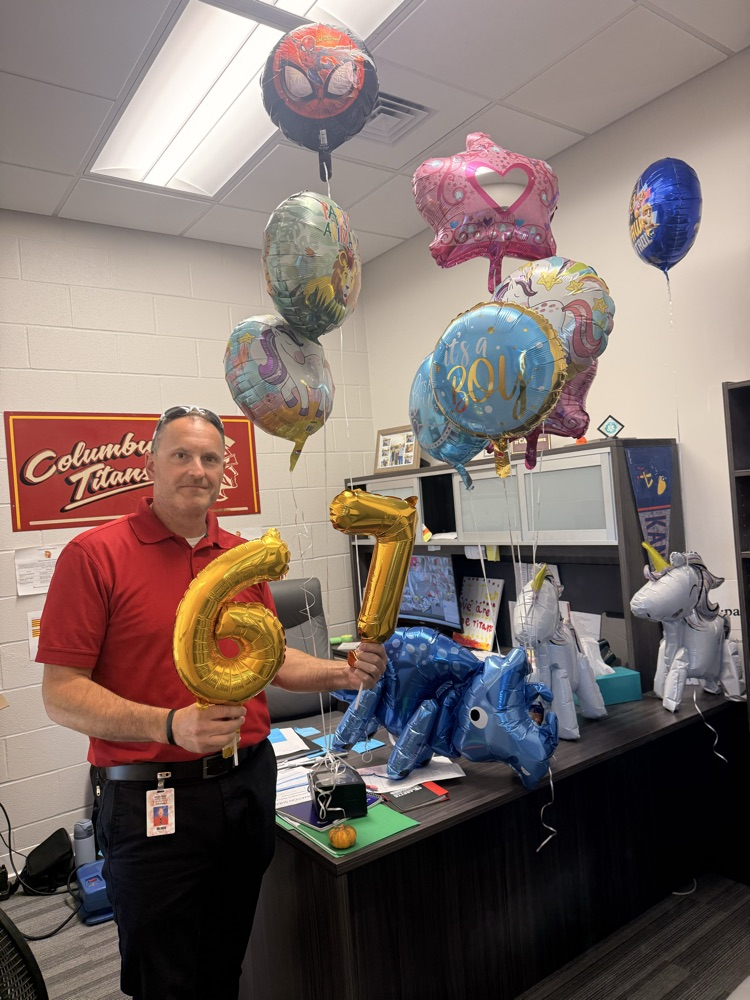Mr. Rider standing with his balloons