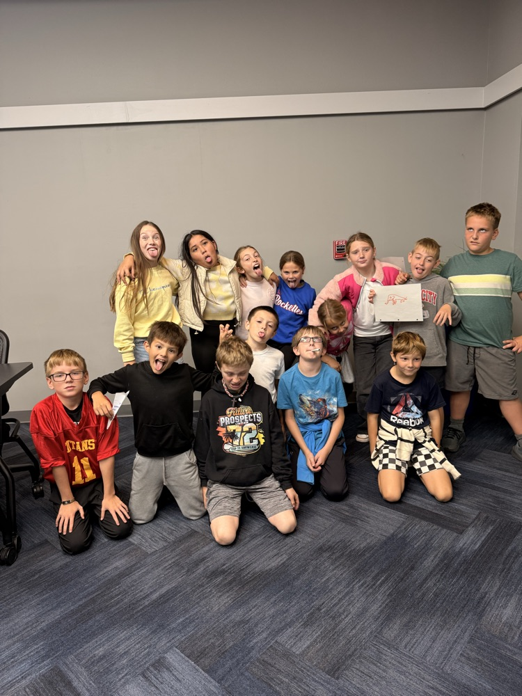 students standing together making silly faces