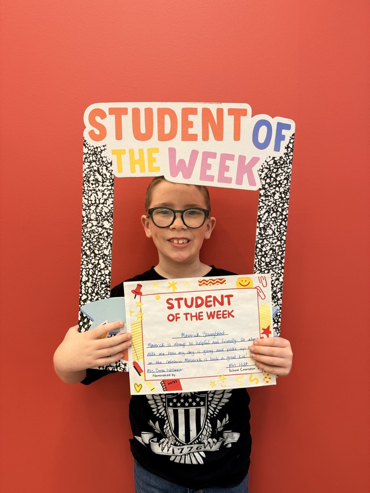 student holding frame and certificate