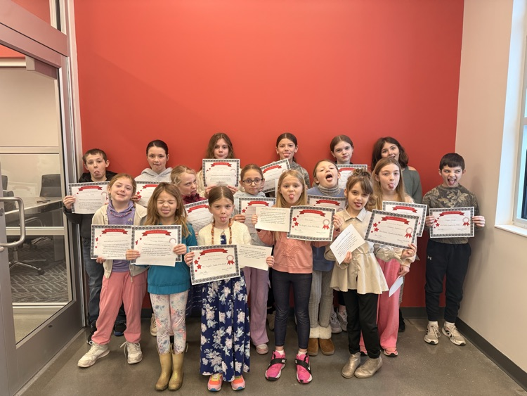 students holding their certificates making silly faces