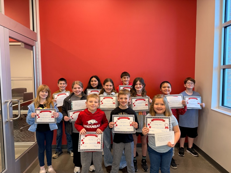 students holding their certificates