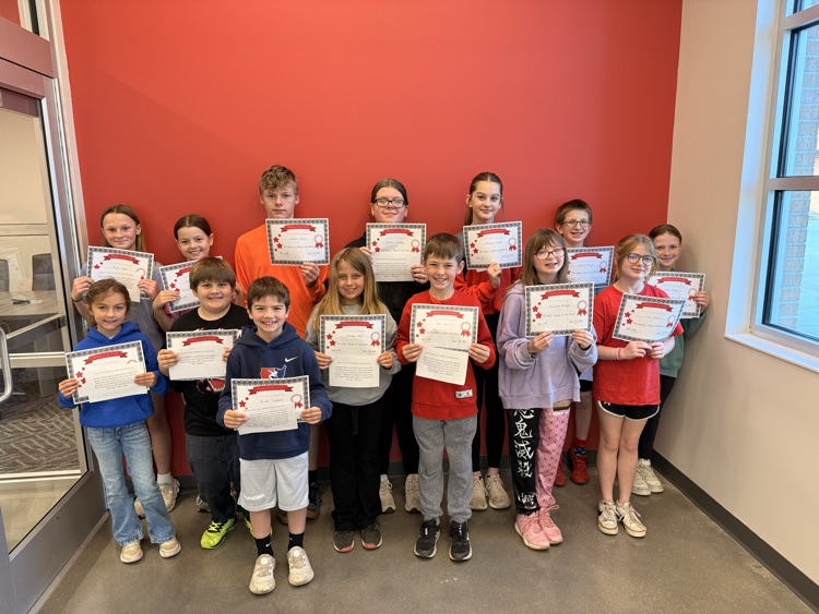 students smile holding certificates 