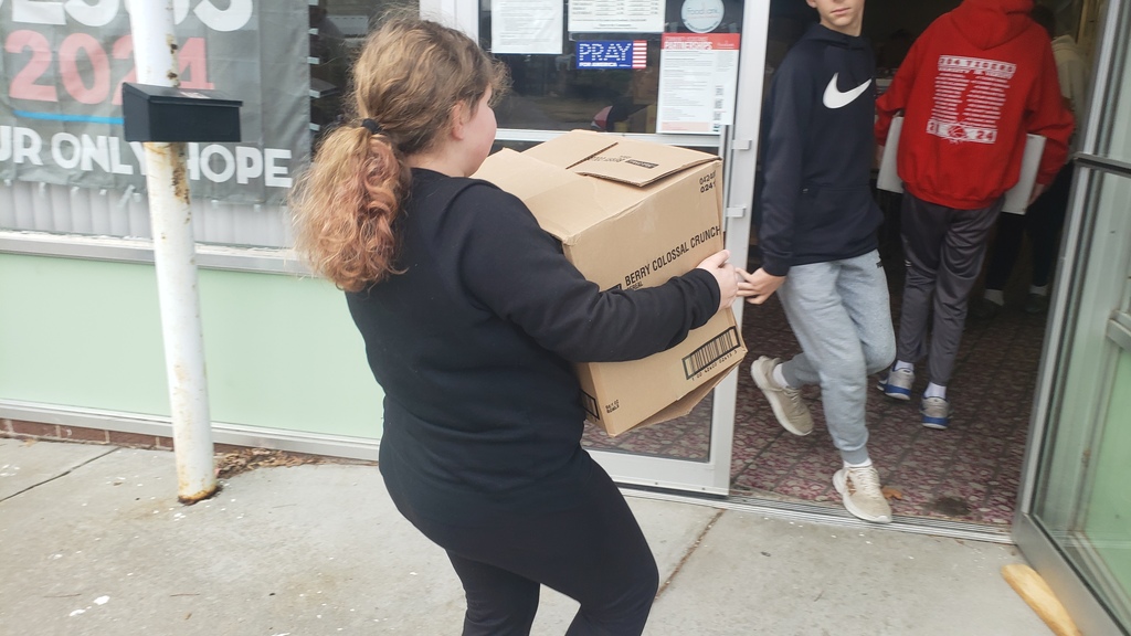 student carrying box