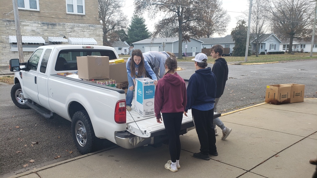 students unloading cans