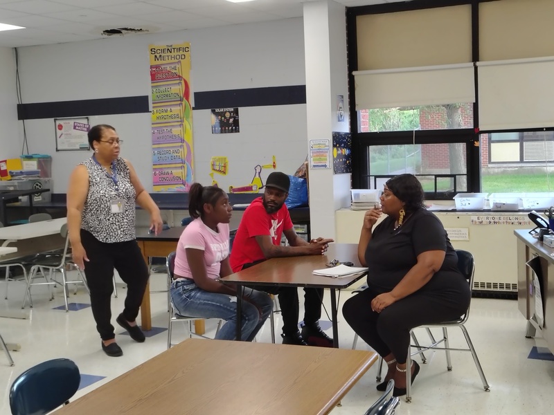 Mrs. Brundige speaks with a family