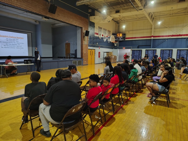 Mr. Bazile greeting the families at Open House
