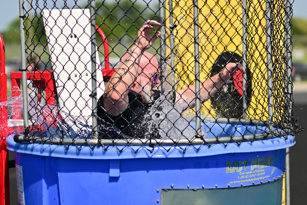 Dr. Berrie goes for a dip in the back to school bash dunk tank.