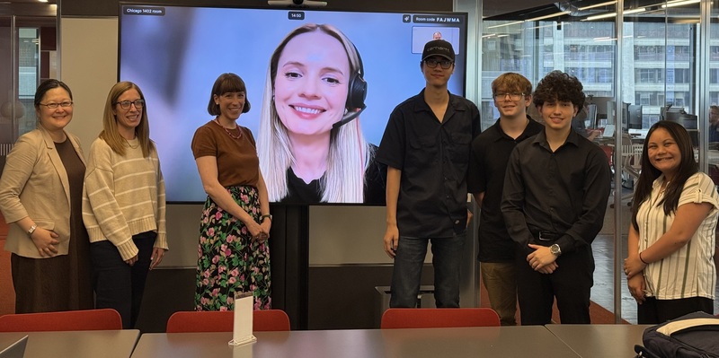 Group of Students and adults witha screen and behind them on a zoom call