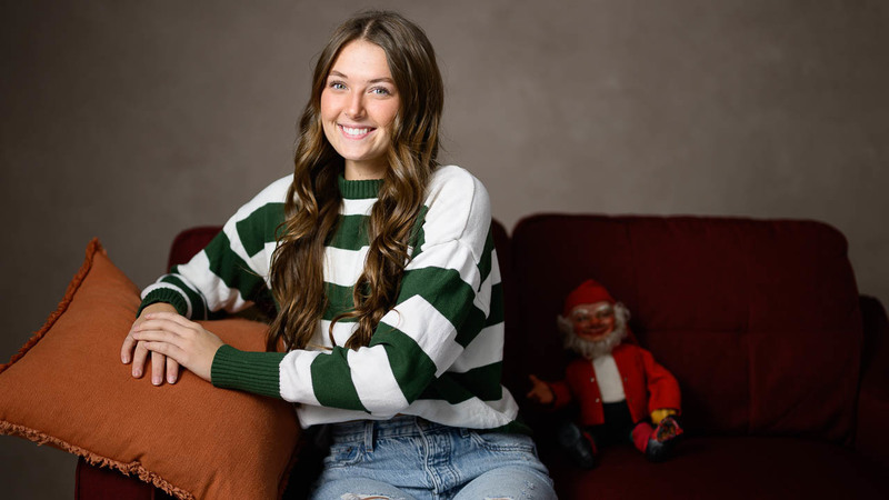 Addison Webb poses with a creepy elf.