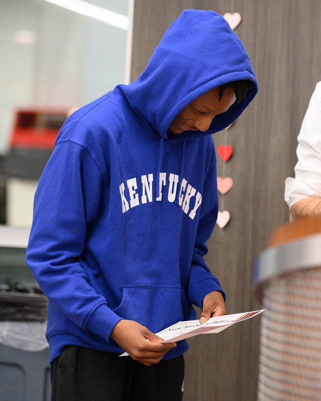 student examines certificate