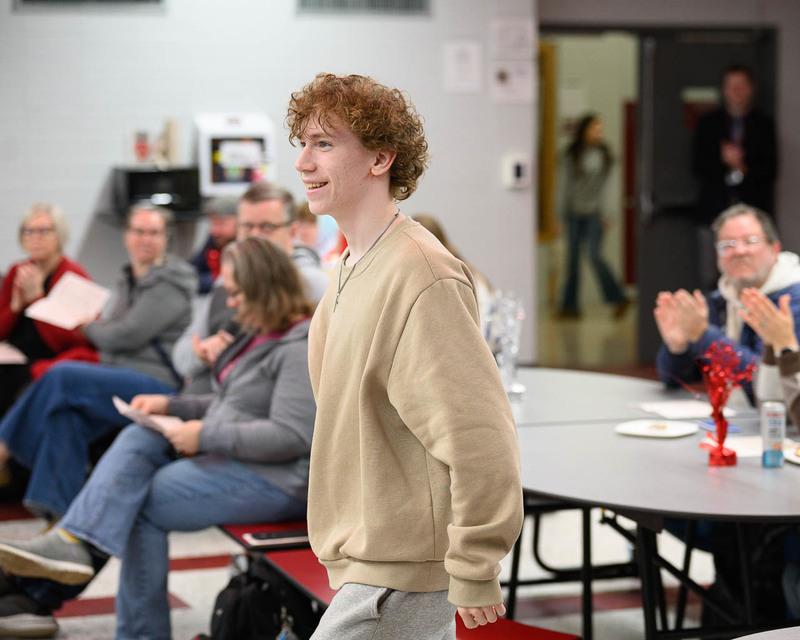 student walks to the podium