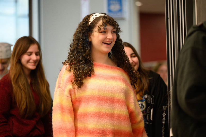 girl walks toward podium to receive award