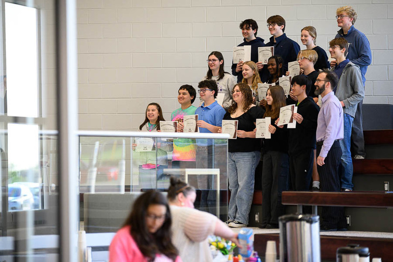 Large group of students pose with their awards