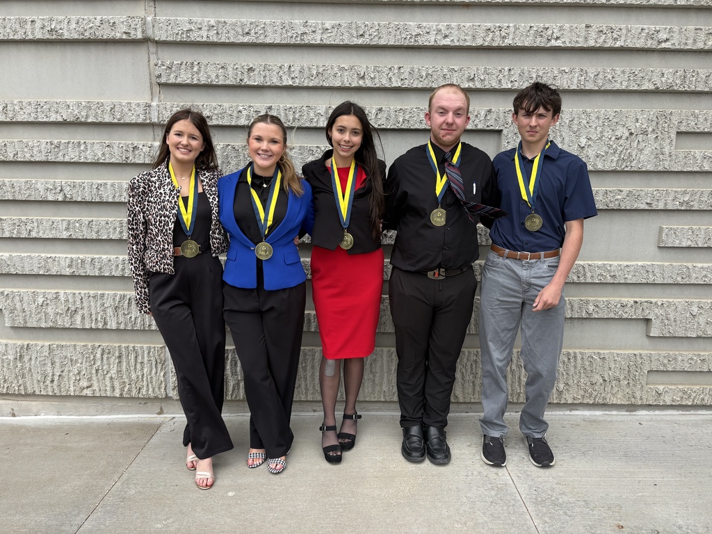 Our FBLA just returned from Springfield, and we are so proud to announce that our parliamentary procedure team — Sophia Fennewald, Gabriella Knipfel, Natali Sommer, Matthew Utterback, and Clayton Crum — placed 8th in the state!  Special shoutouts: Natali competed in Introduction to Public Speaking in the preliminary round on Sunday and advanced to the finals on Monday. Final results place her in the top 15 in the state! Matthew competed in Personal Finance. Sophie competed in Introduction to Parliamentary Procedure. We’re so proud of all five students for their hard work and dedication. Please join us in congratulating them! Gabby, Sophie, Natali, Clayton and Matthew pose in front of a brick building wearing their medals..