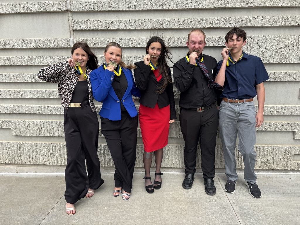Our FBLA just returned from Springfield, and we are so proud to announce that our parliamentary procedure team — Sophia Fennewald, Gabriella Knipfel, Natali Sommer, Matthew Utterback, and Clayton Crum — placed 8th in the state!  Special shoutouts: Natali competed in Introduction to Public Speaking in the preliminary round on Sunday and advanced to the finals on Monday. Final results place her in the top 15 in the state! Matthew competed in Personal Finance. Sophie competed in Introduction to Parliamentary Procedure. We’re so proud of all five students for their hard work and dedication. Please join us in congratulating them! Gabby, Sophie, Natali, Clayton and Matthew pose showing their medals.