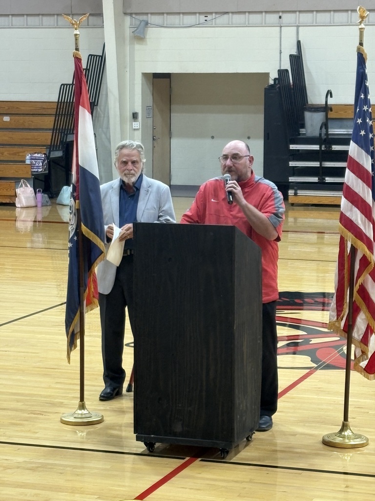 Mr. Atkinson introduces Mr. Maxwell by the podium. 