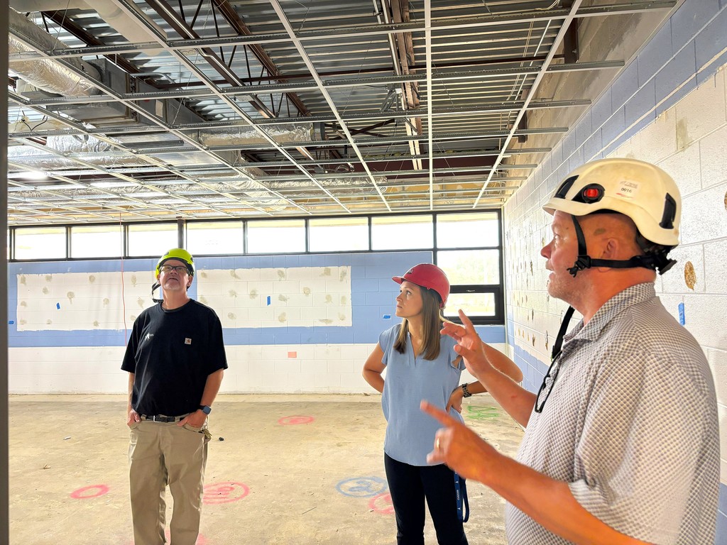 Admins inspecting Monroe Middle School construction
