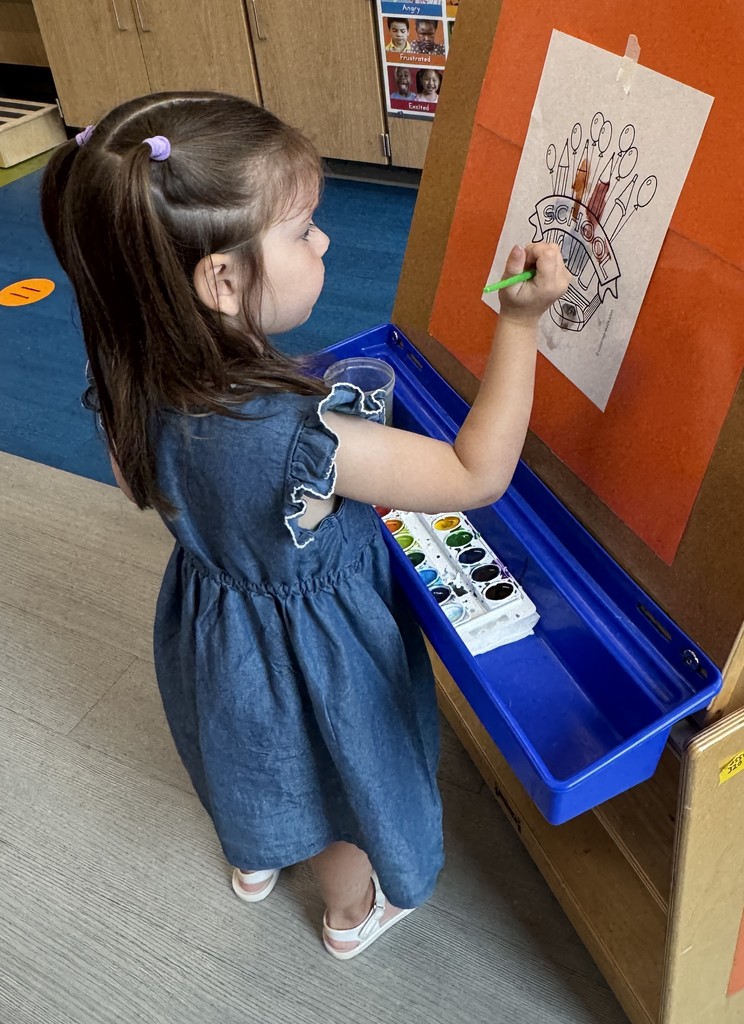 Girl at painting easel