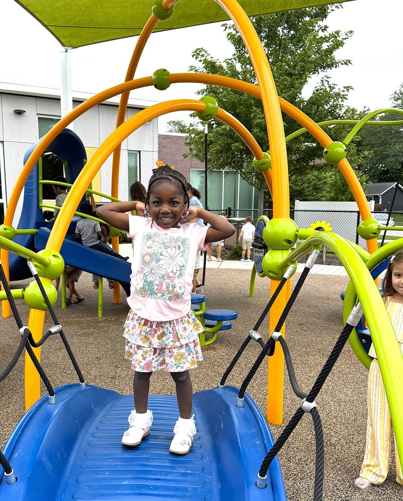 Girl on playground bridge