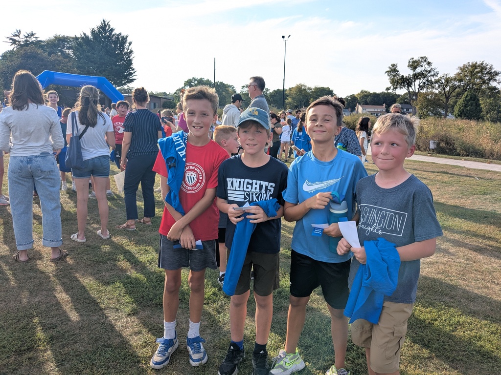 Four boys with running gear and ribbons