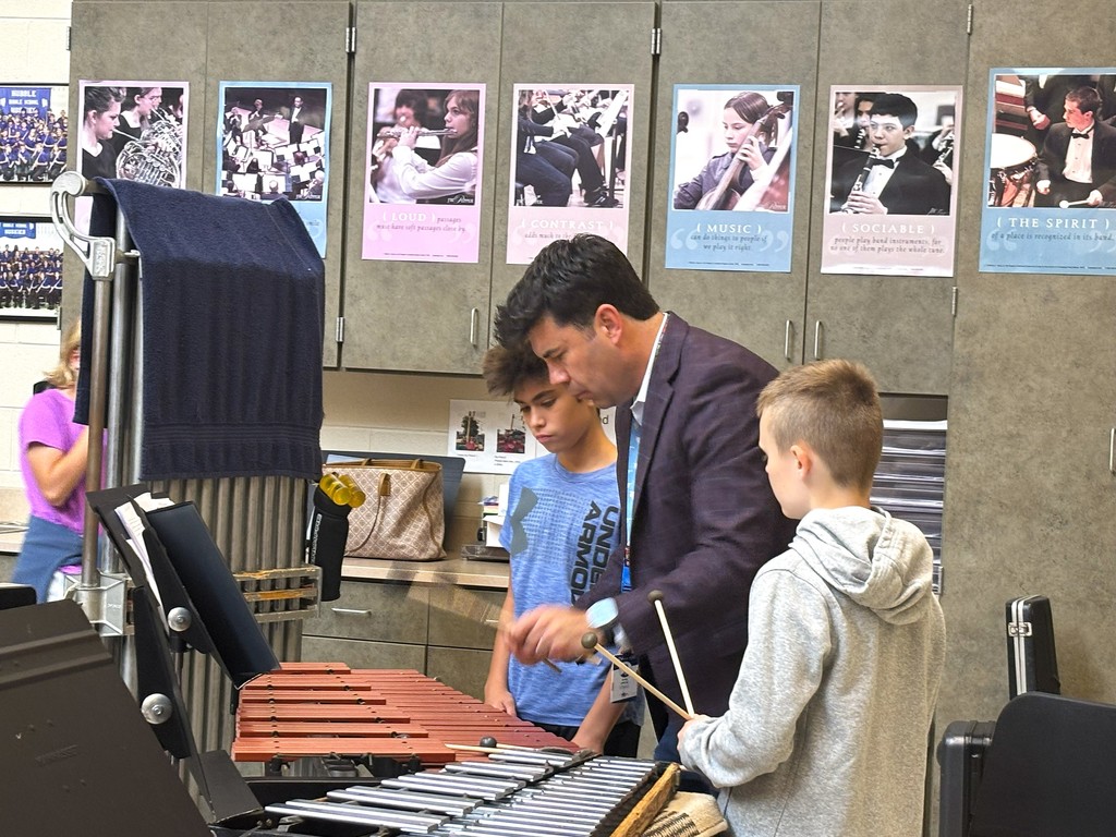 band director with percussion students