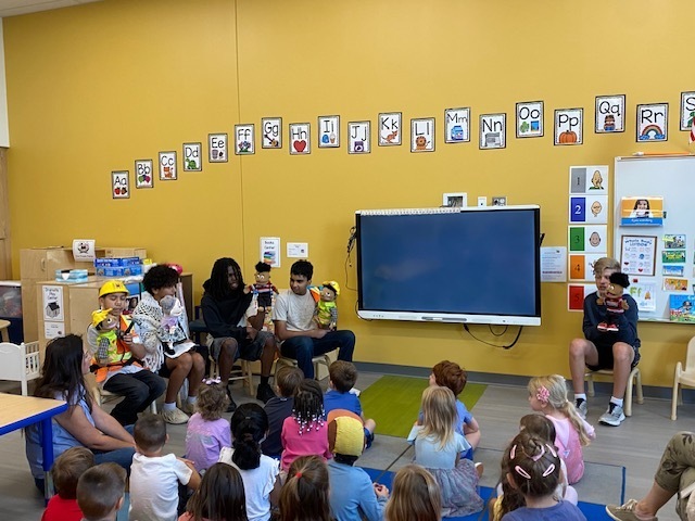 Middle school students perform puppet show