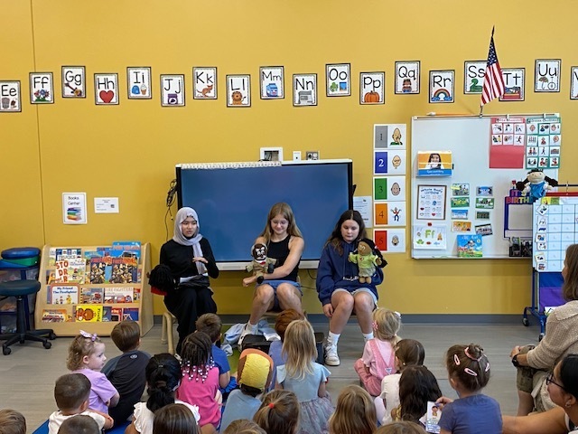 Middle school students perform puppet show