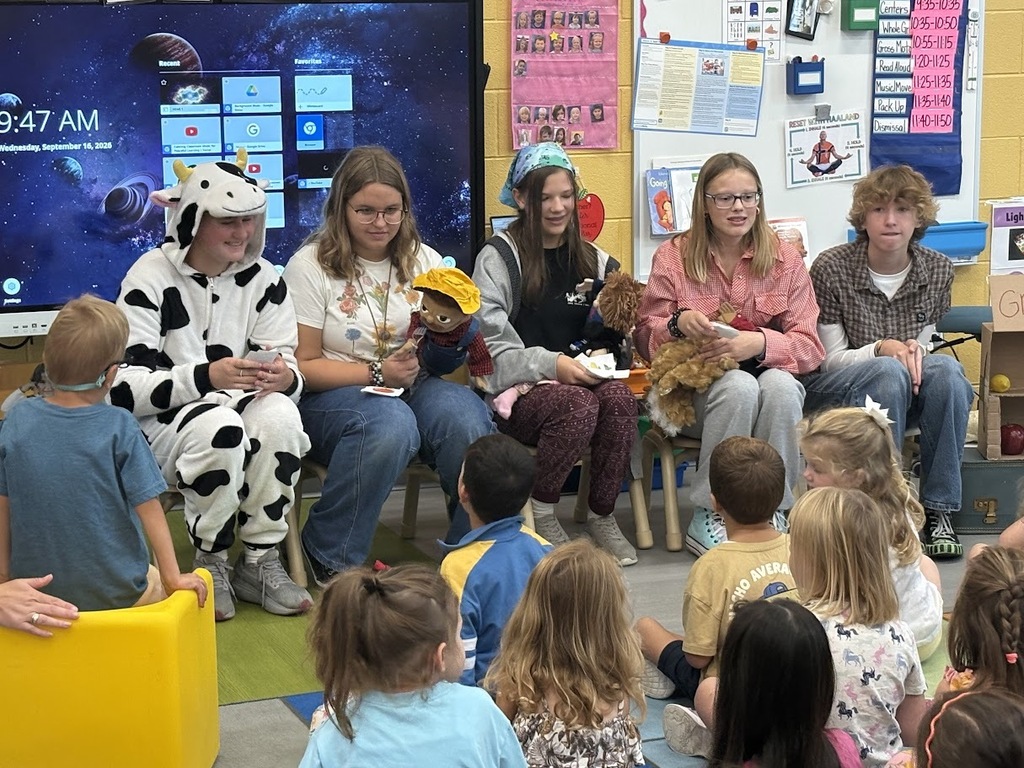 Middle school students perform puppet show