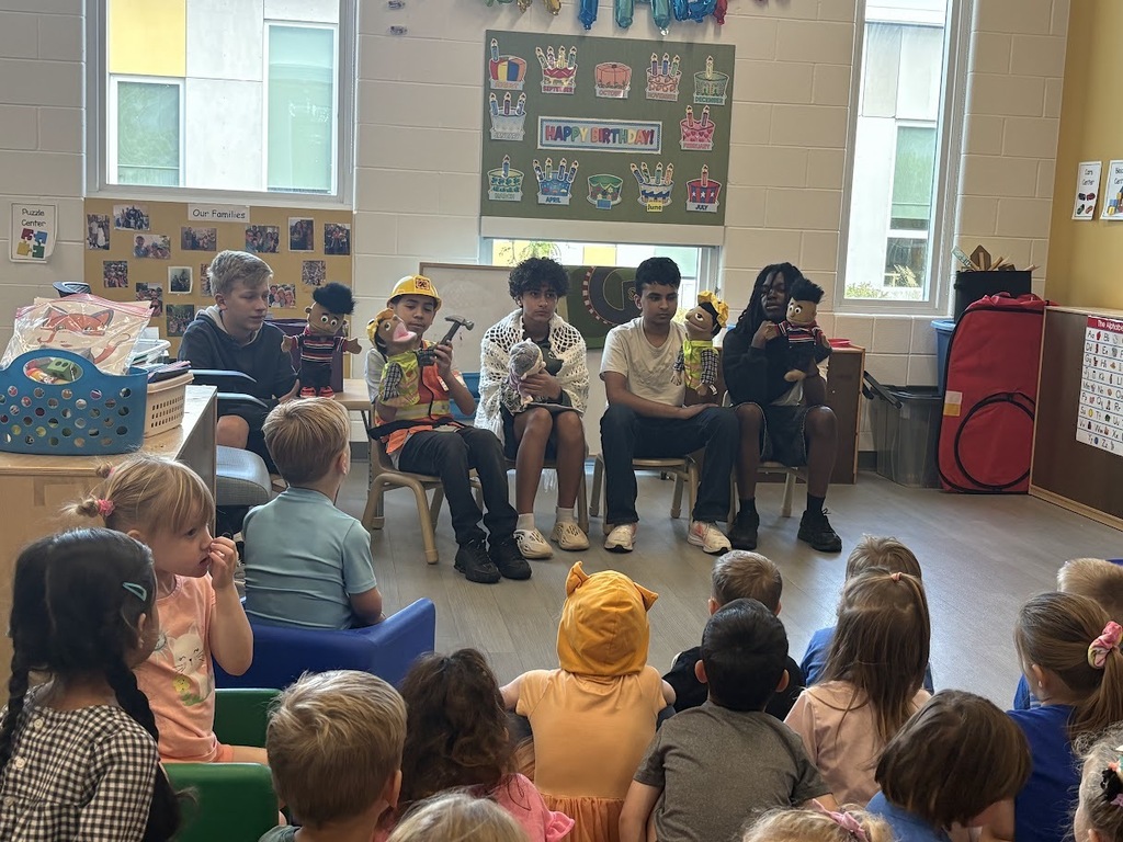 Middle school students perform puppet show