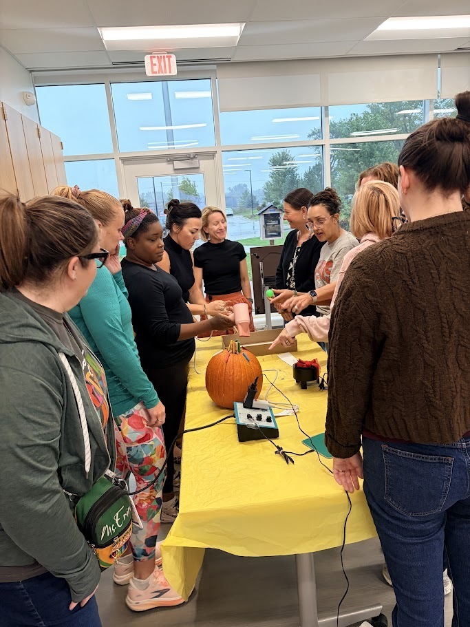 staff play with adapted toys