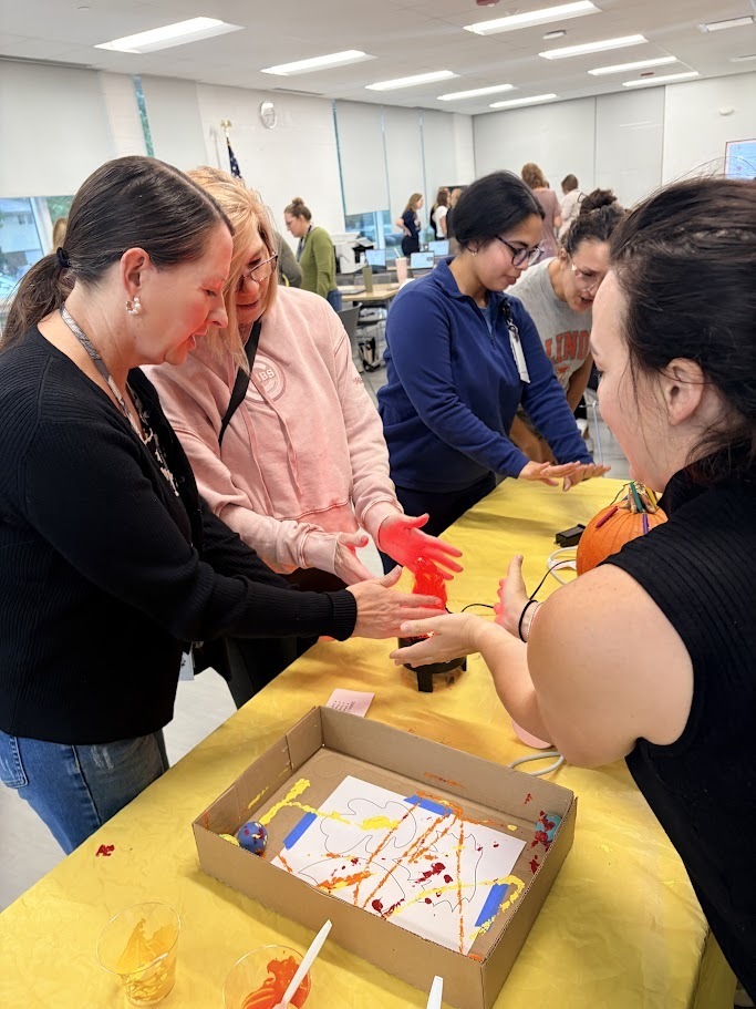 staff play with adapted toys