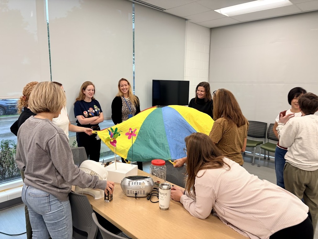 staff play with adapted toys