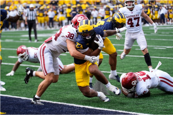Jordan Marshall (23) scores the final Wolverines TD shutting down the Sooners chances of winning