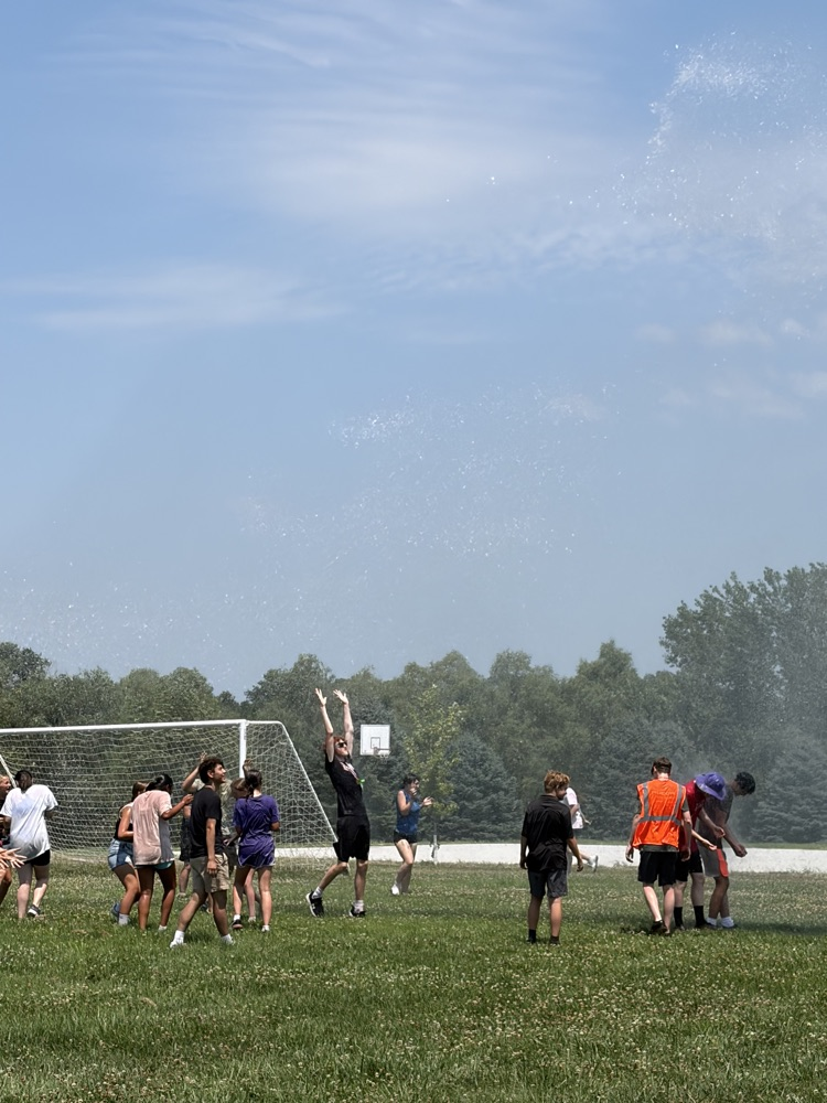 Students playing in water. 