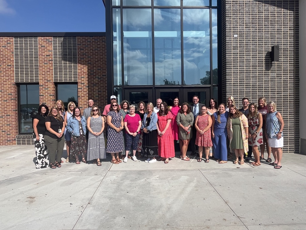 Staff in front of new building 