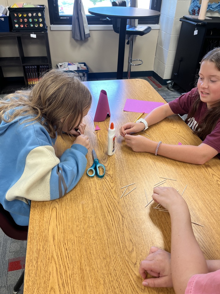 Students building with glue