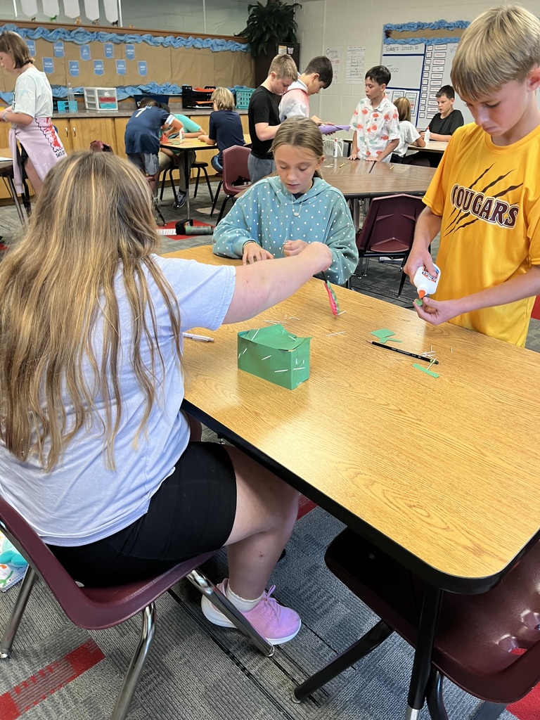 Students building with supplies