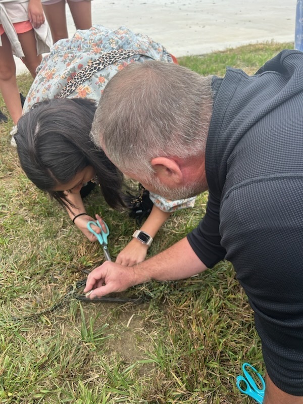 Teachers helping a snake 