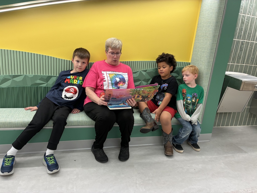 Kids and teacher reading 
