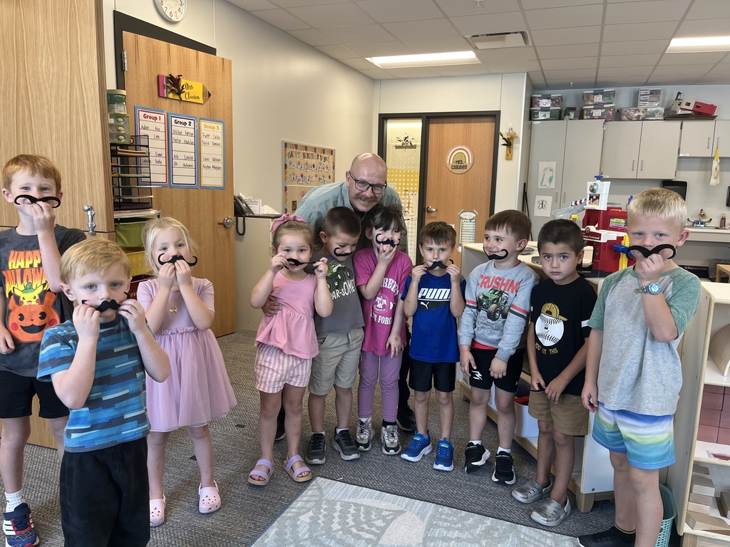 Kids wearing a mustache 