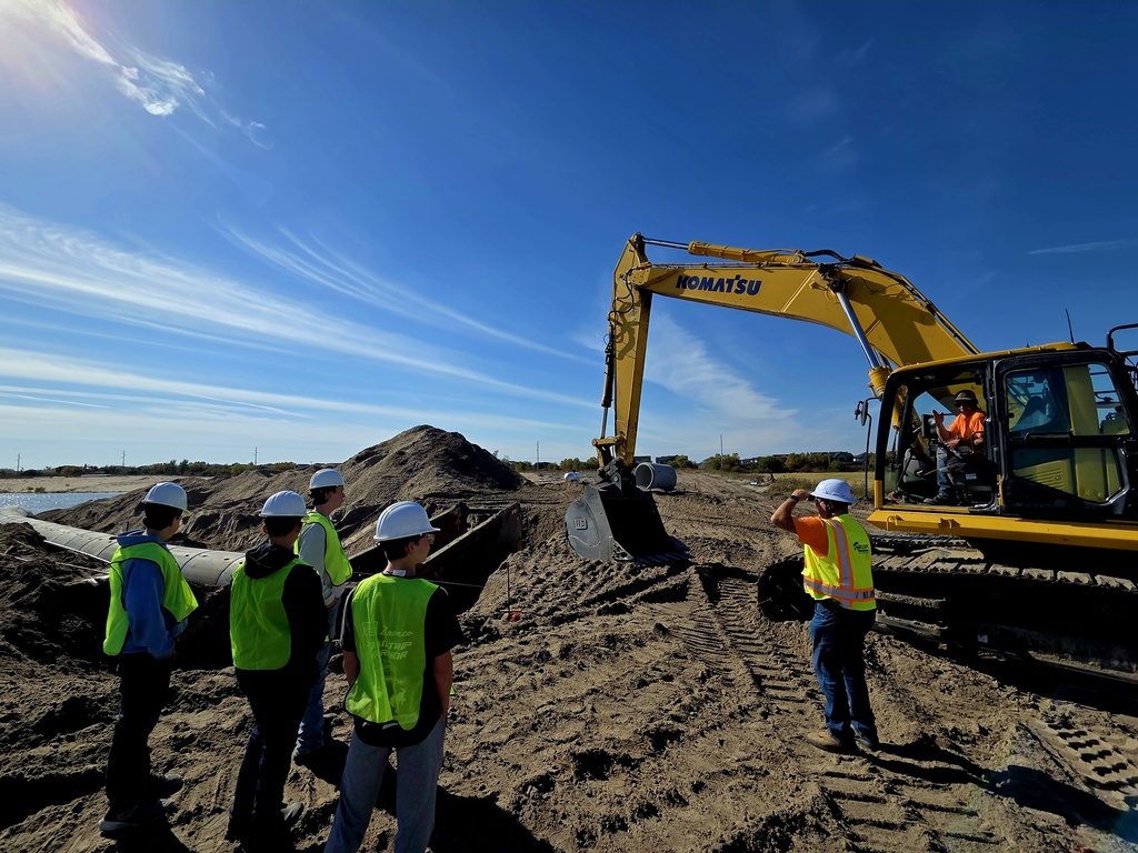 Students with excavator