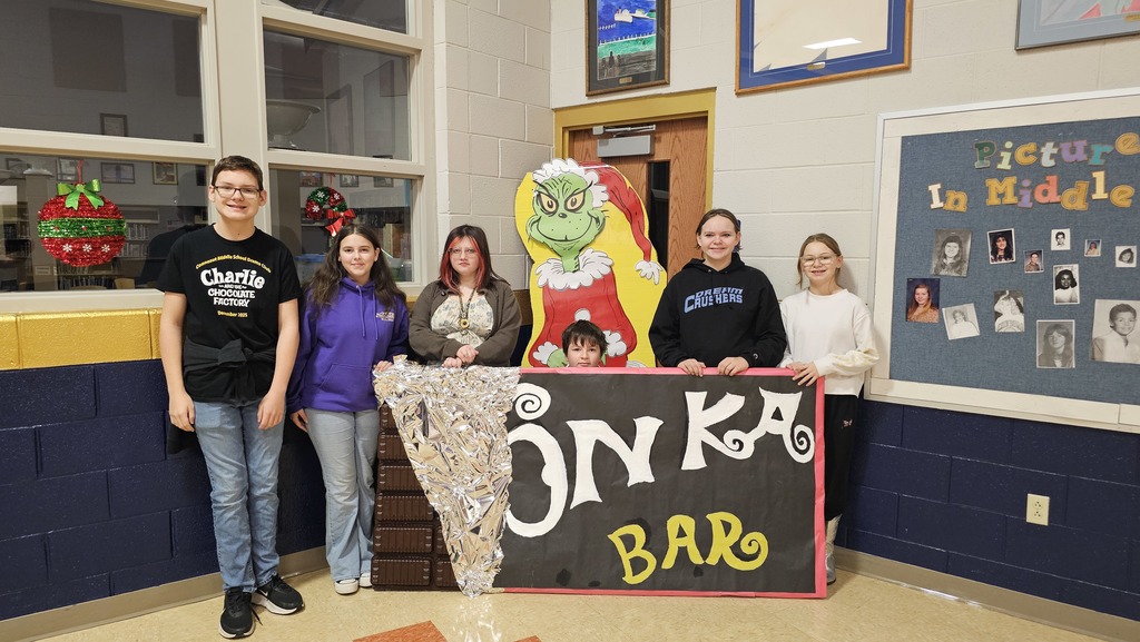 Students standing with a giant Chocolate Bar