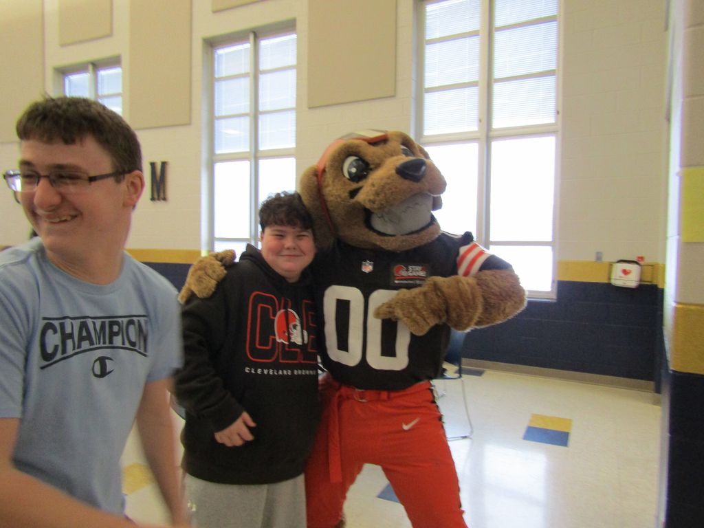 Chomps hugging a student