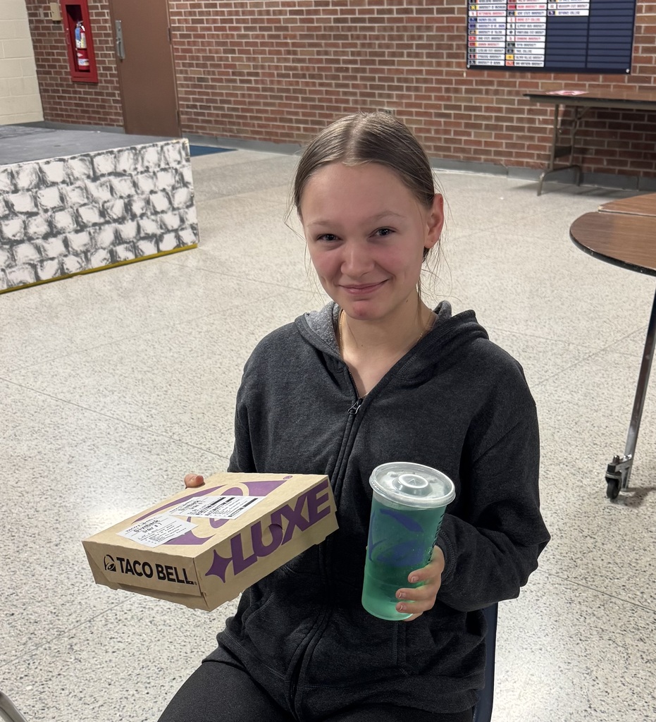 Zoe Mosher is pictured holding the taco bell lunch she won for having perfect attendance! 