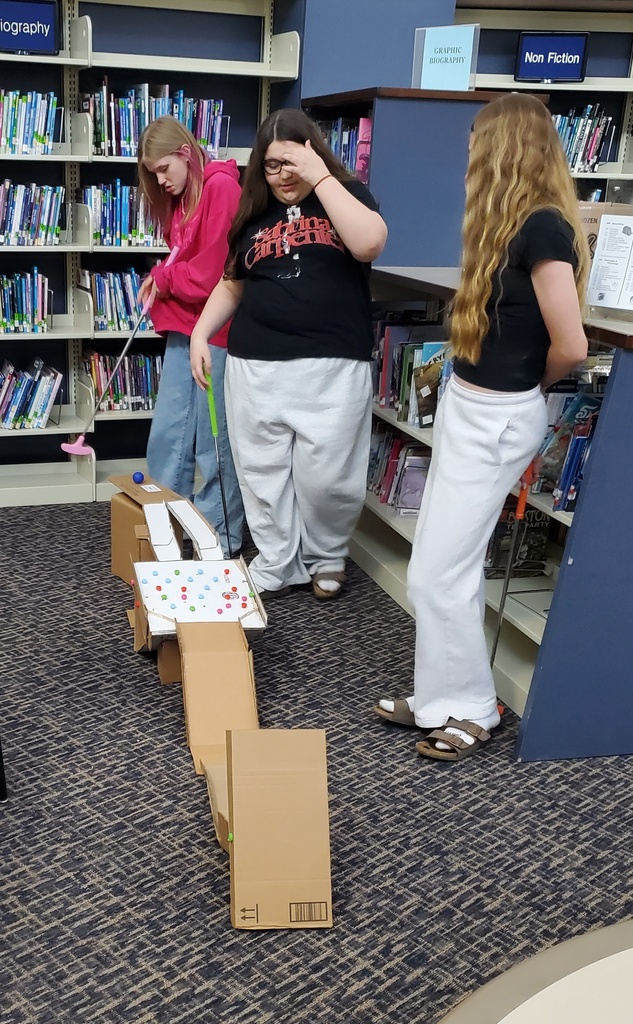 Girls playing putt putt