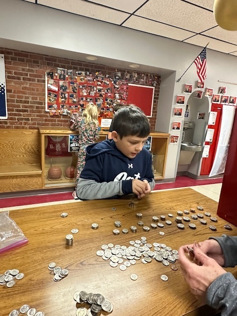 Bobcat Fan Counting Coins